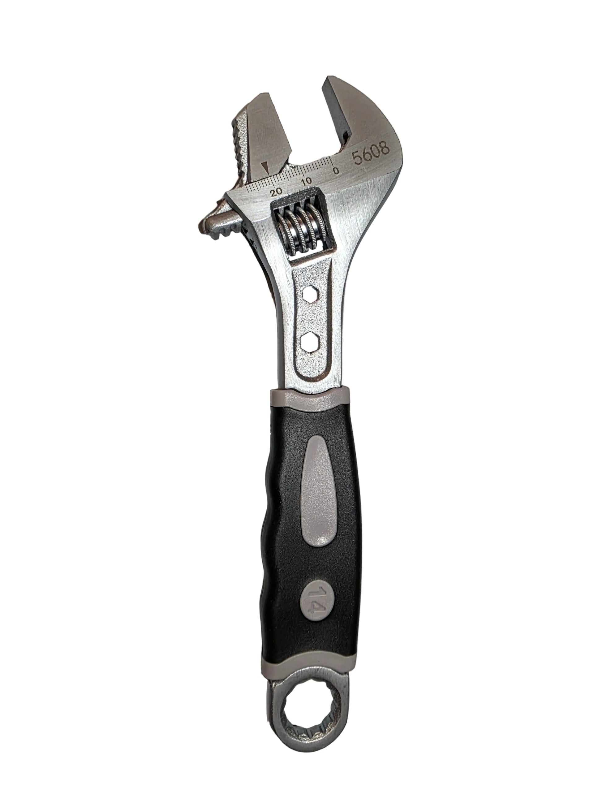 Adjustable wrench on a textured gray surface