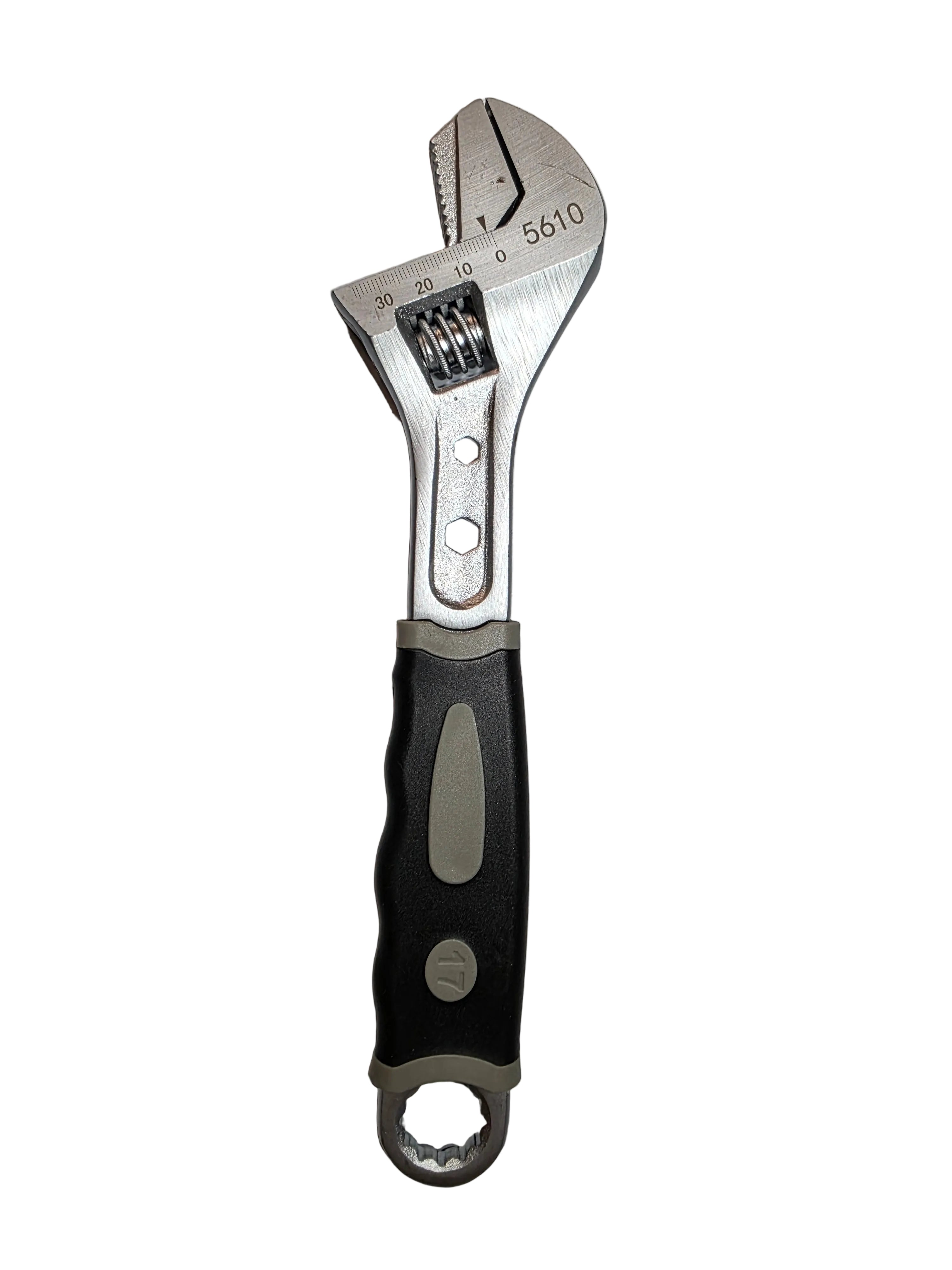 Adjustable wrench on a textured gray background