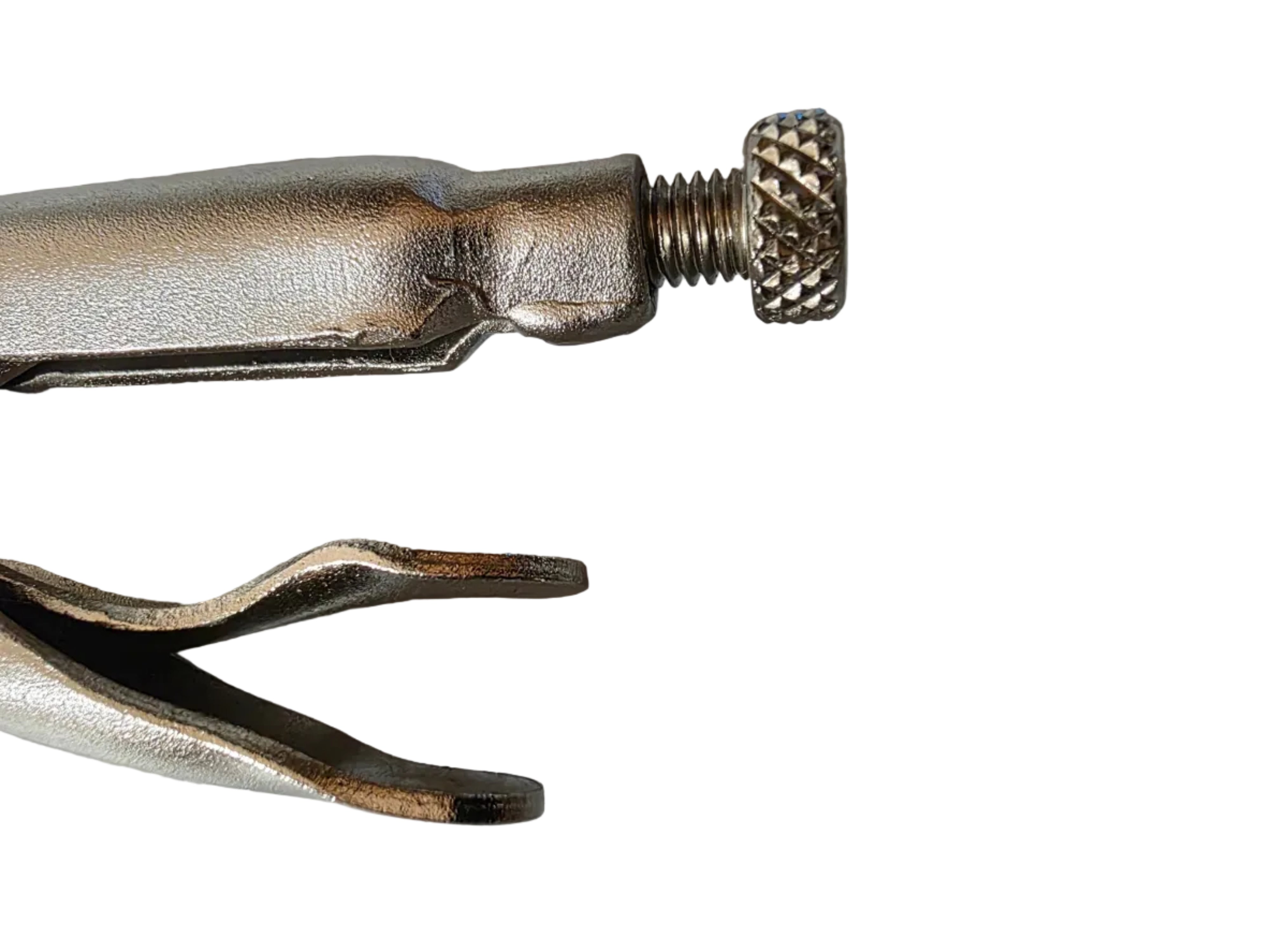 Metal tool with a threaded end on a textured surface