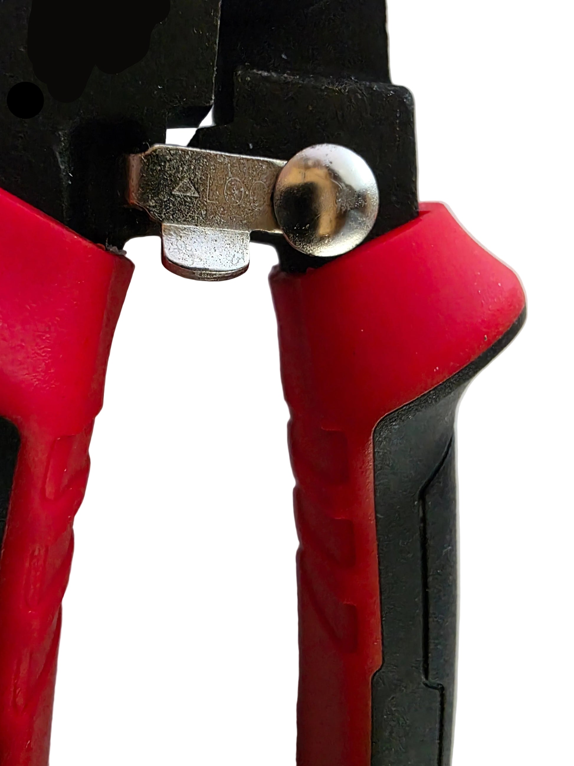 Close-up of a red and black tool with a metallic component on a white background