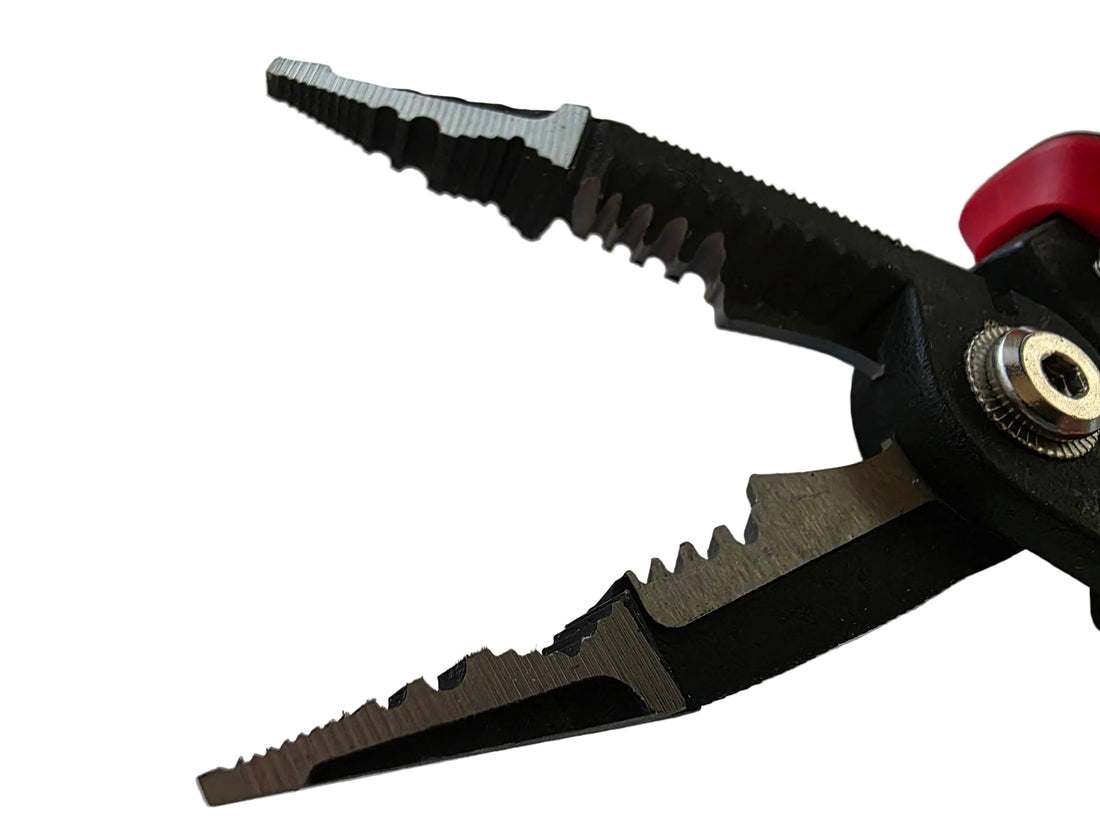 Pair of black and red pliers on a white background