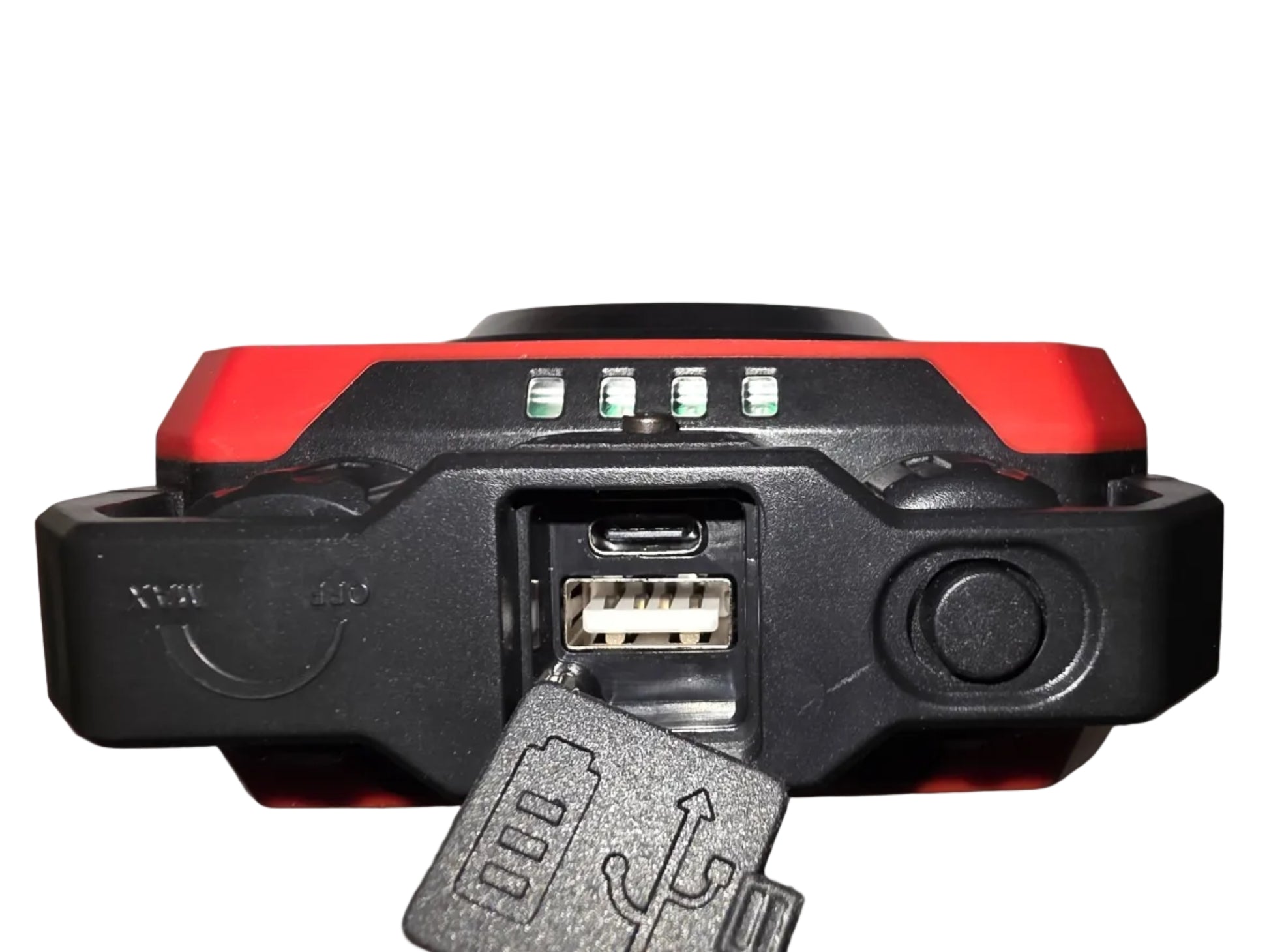 Close-up of a red and black electronic device with USB and micro USB ports on a gray background