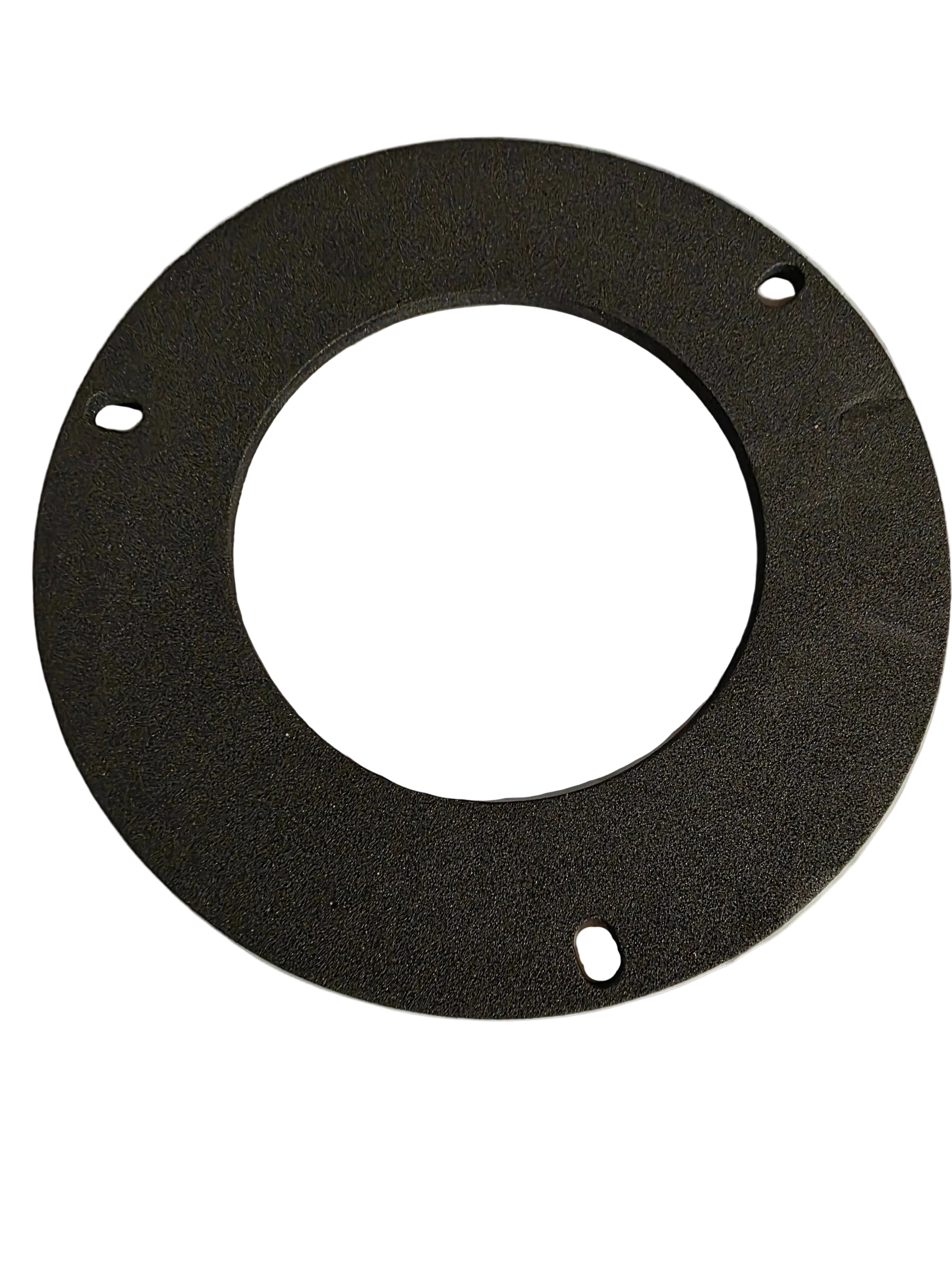 Round black foam ring on a textured white background