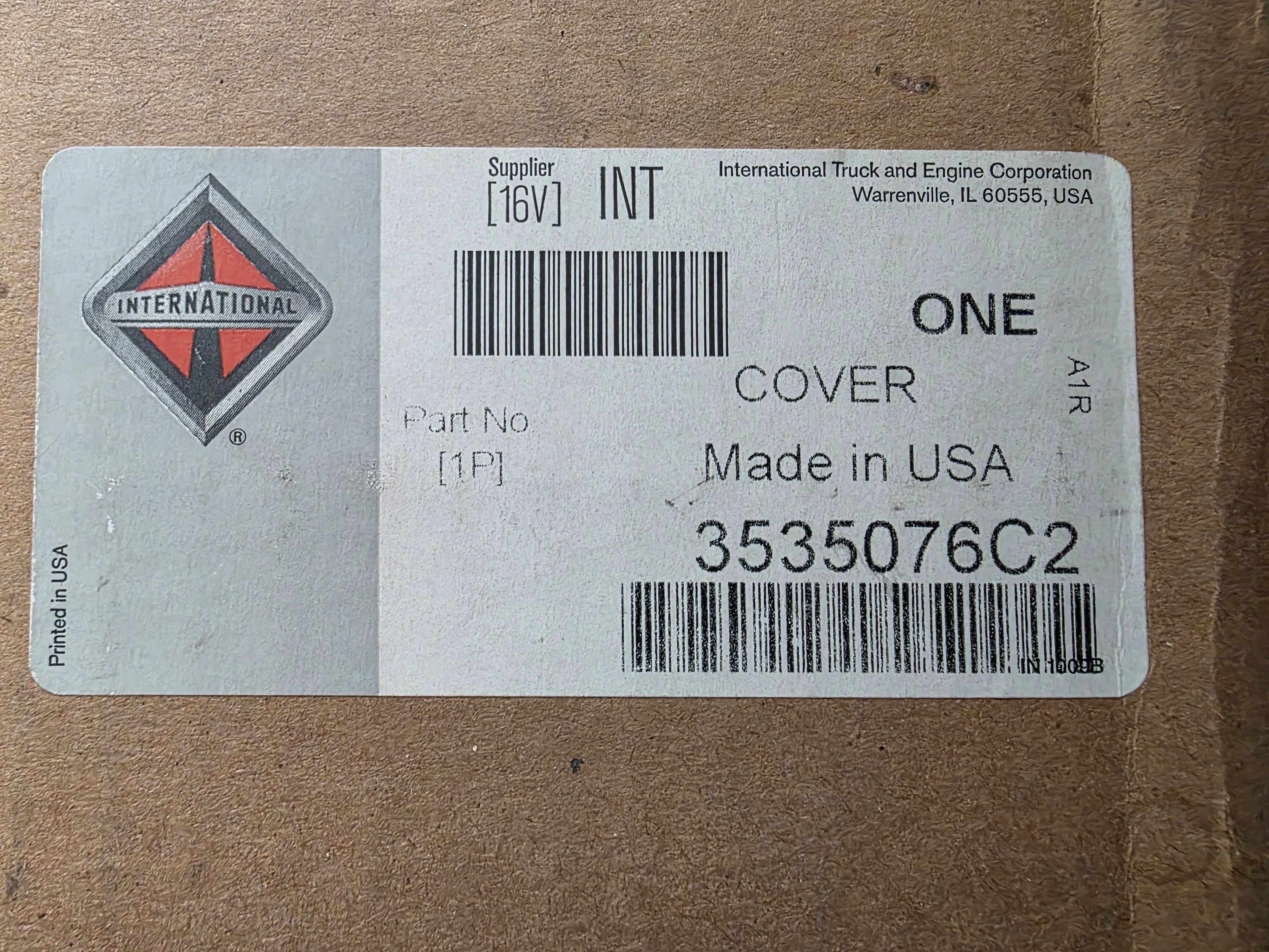 Label on a cardboard box with International Truck and Engine Corporation branding and product details.