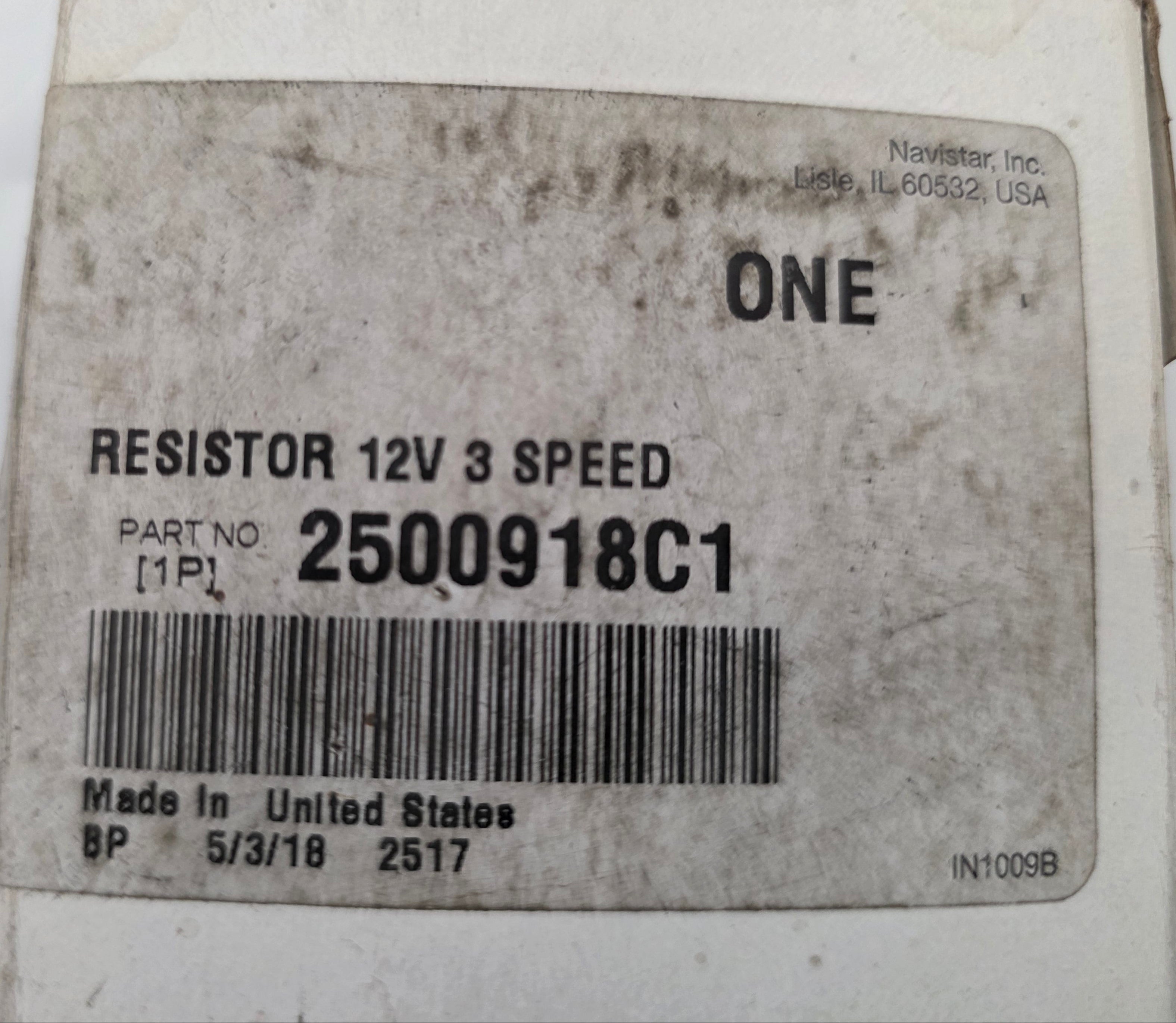 A close-up of a white plastic component box with a printed label reading 'RESISTOR 12V 3 SPEED', 'ONE', and 'PART NO 2500918C1' with a barcode.