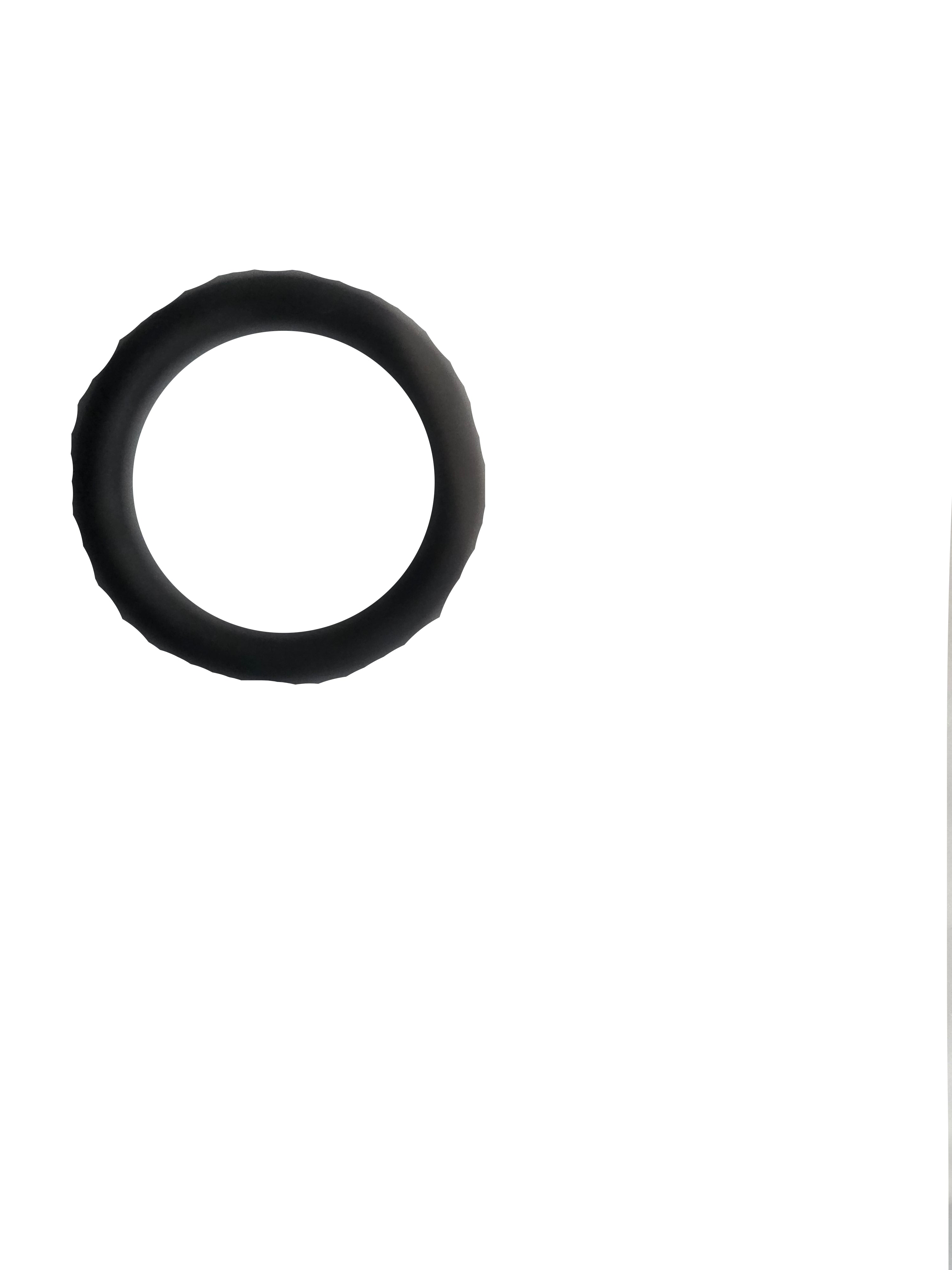 A black rubber O-ring resting on a crumpled translucent plastic surface.