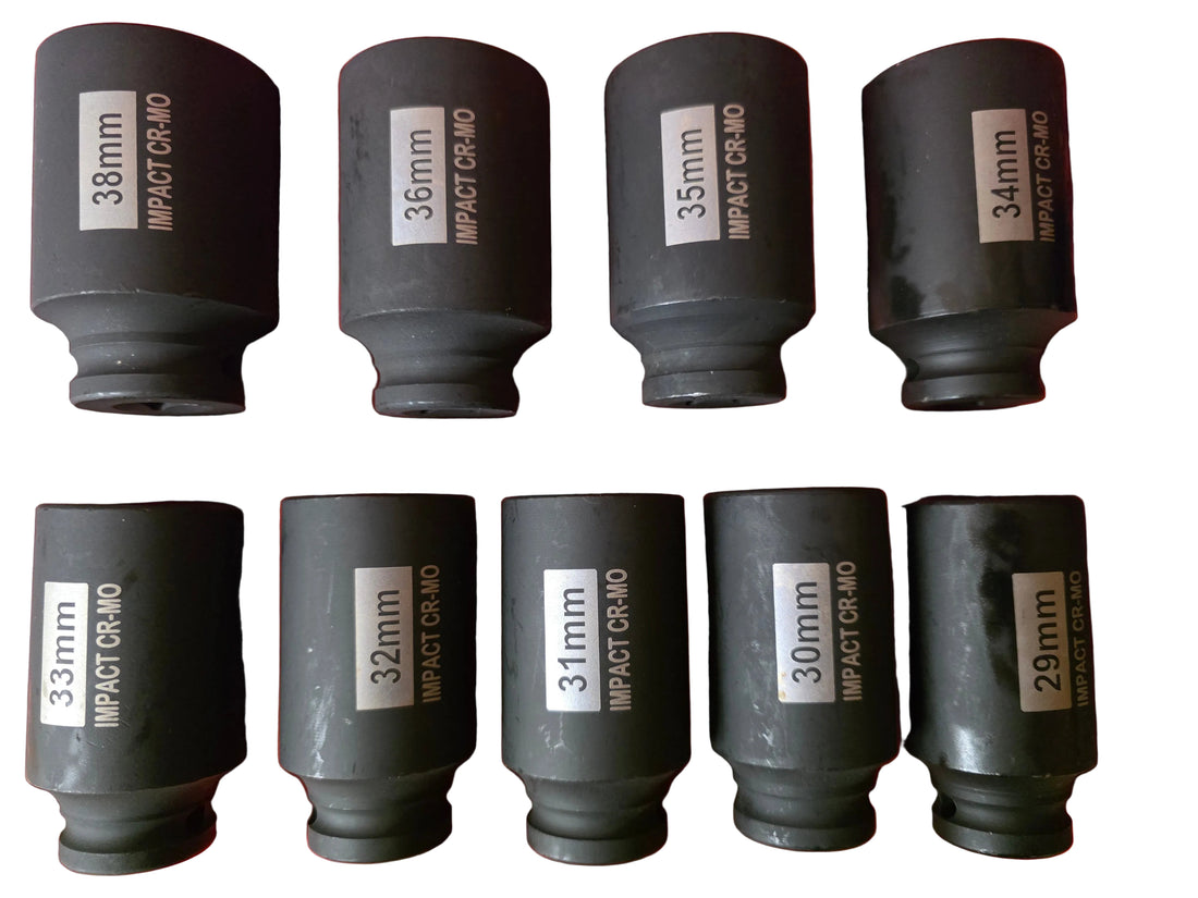 A set of eight black impact socket wrenches in different sizes (29mm to 38mm) arranged in a red plastic case. Each socket has a white label with black text reading '30mm' or its size and 'IMPACT CR-MO'.
