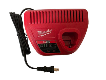 A red Milwaukee M12 battery charger with a black power cord, photographed on a white surface.