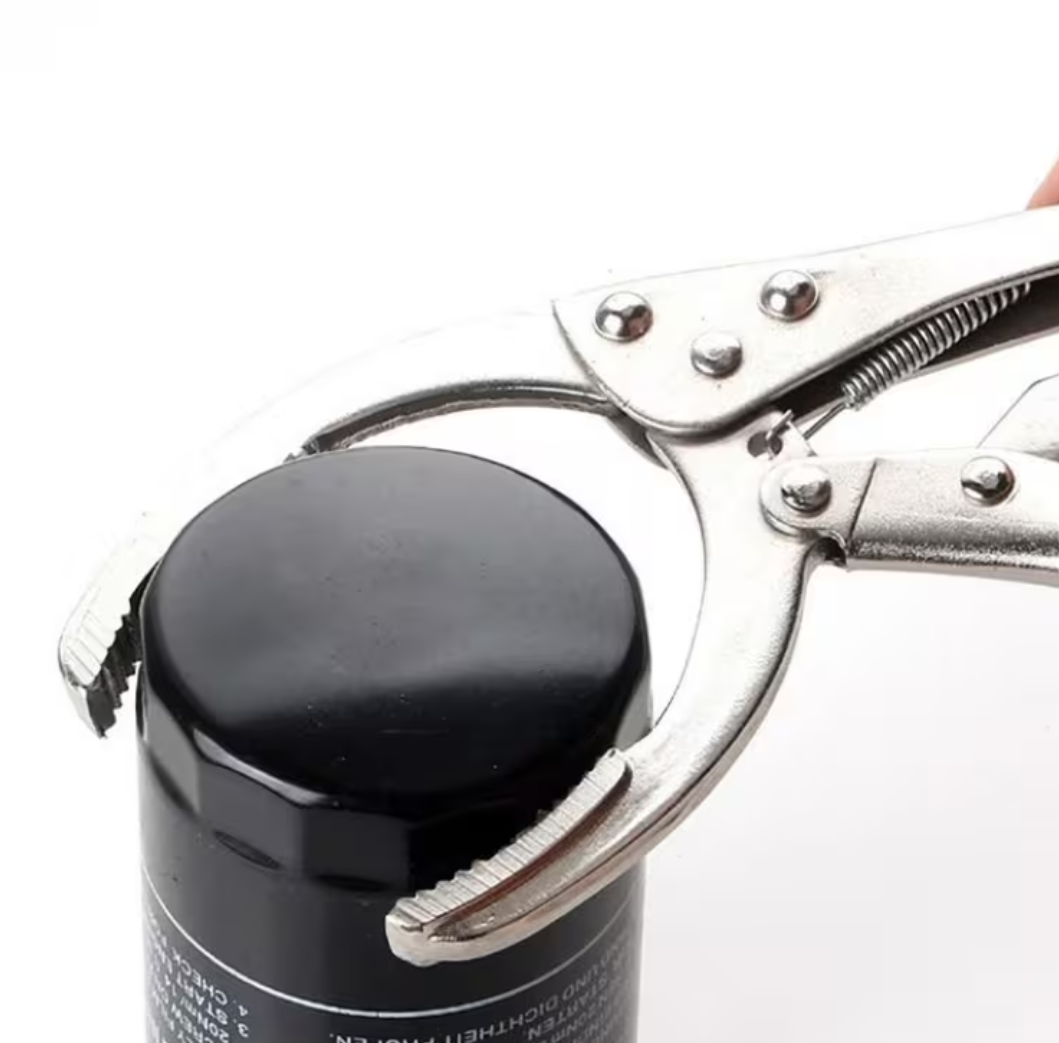 Black canister with a metal tool on a white background