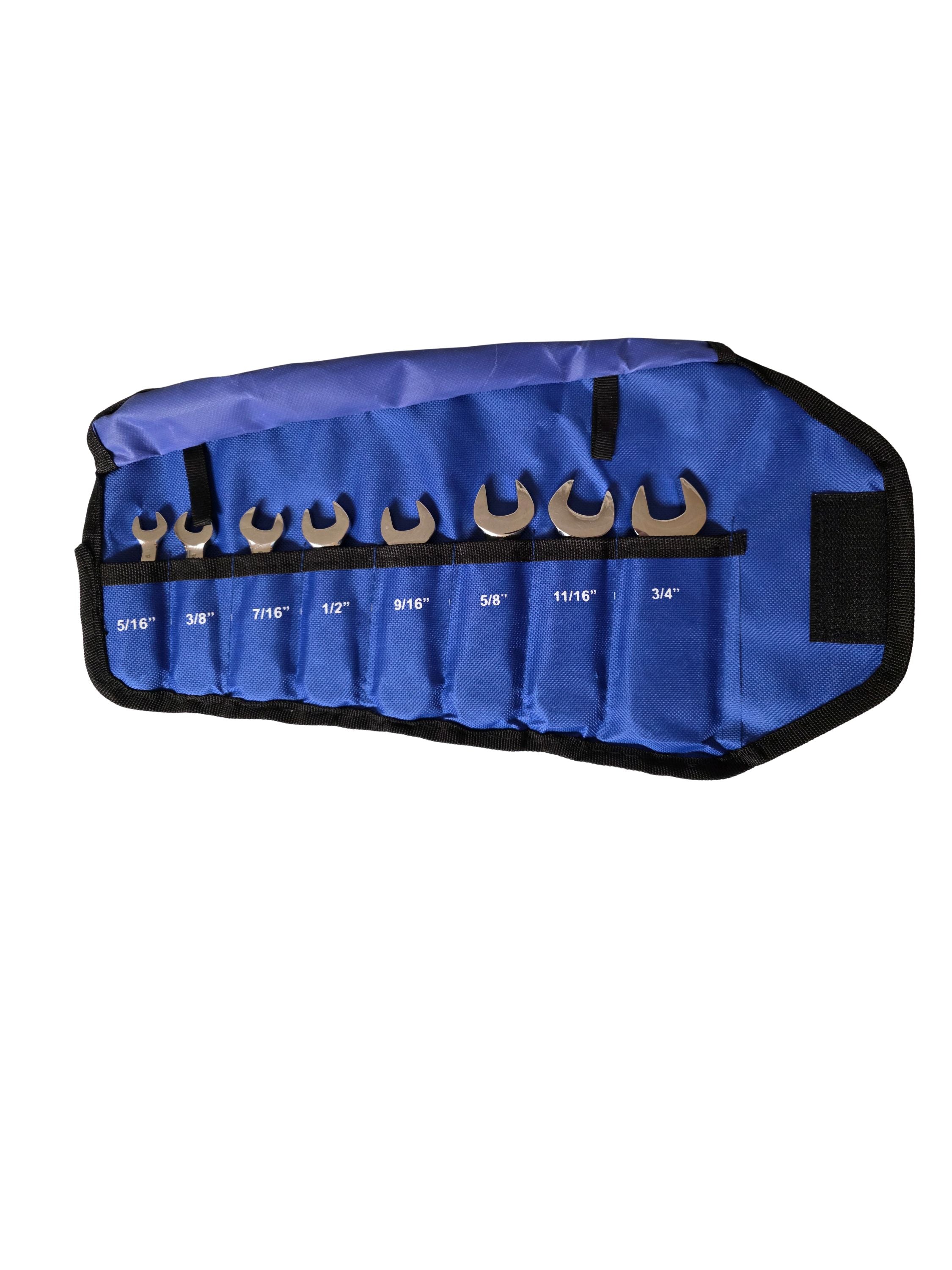 Set of wrenches in a blue roll-up tool bag on a white background