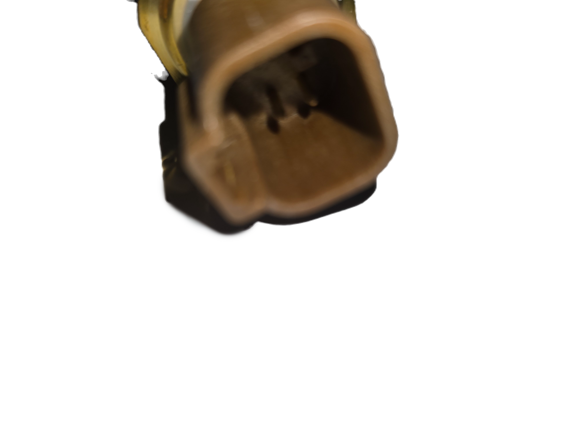 Close-up of a brown automotive connector on a white background
