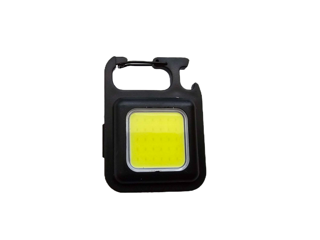 Small yellow light with black casing on a white background
