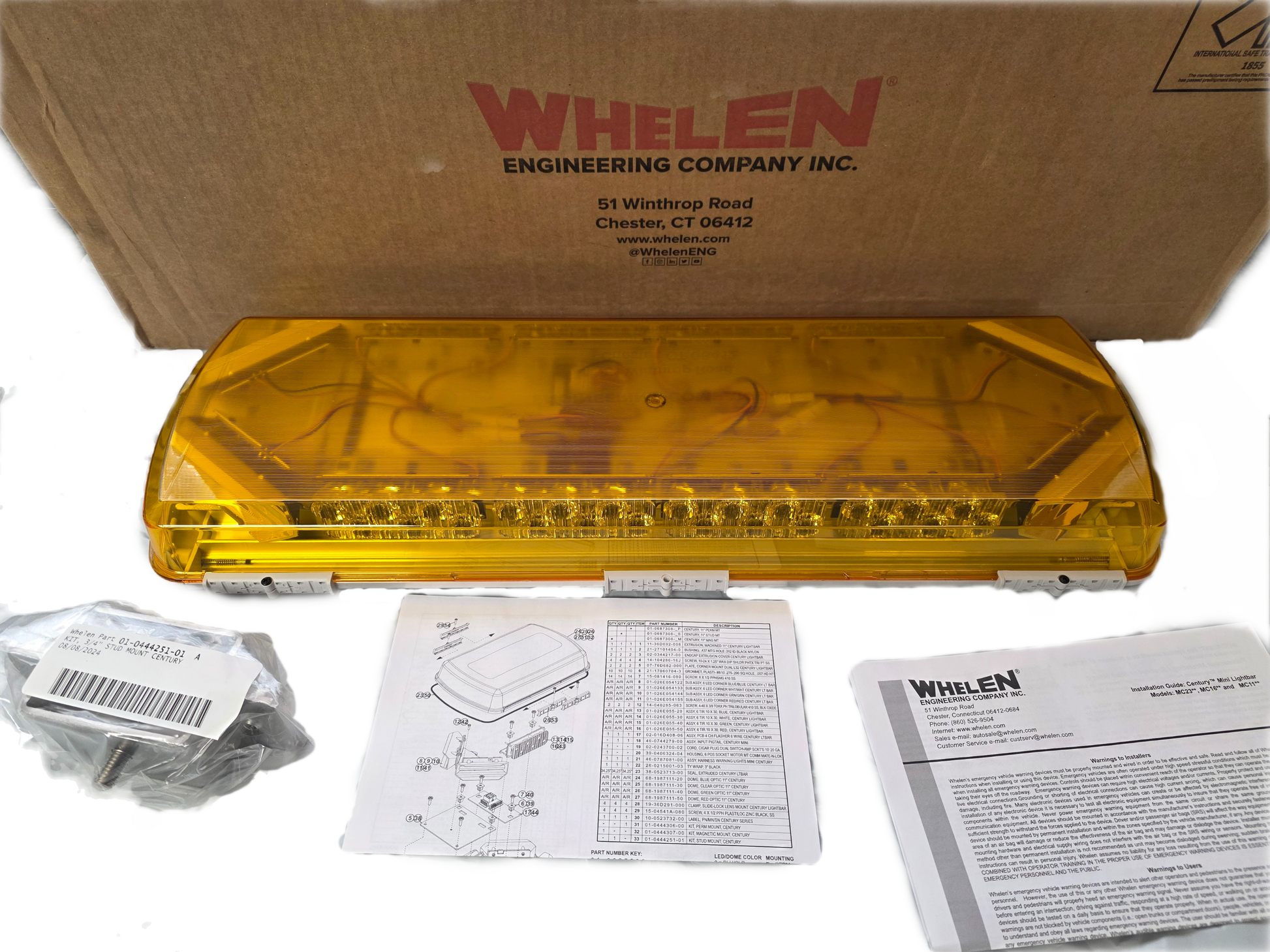 Yellow Whelen lightbar with packaging and documentation on a white background