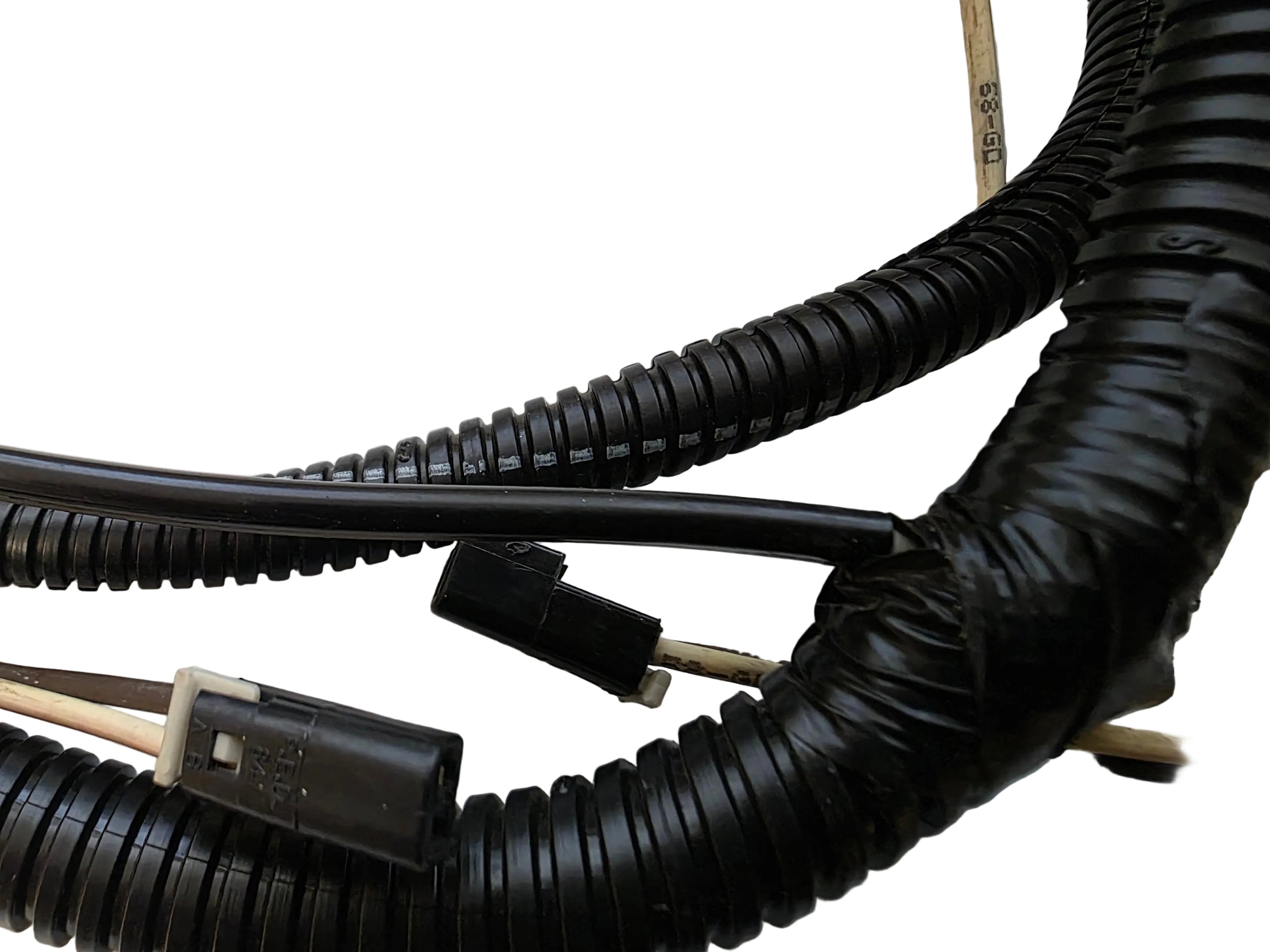 Black corrugated electrical wire harness with plastic connectors on a white background.
